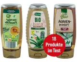 Drei Flaschen Agavendicksaft, eine natürliche Alternative zu honig, stehen nebeneinander. Ein roter Kreis verkündet "18 Produkte im Test".